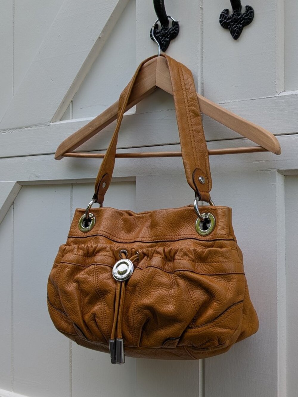 B. Makowsky Cognac Tan Pebbled Leather Drawstring Medallion Hobo Shoulder Bag